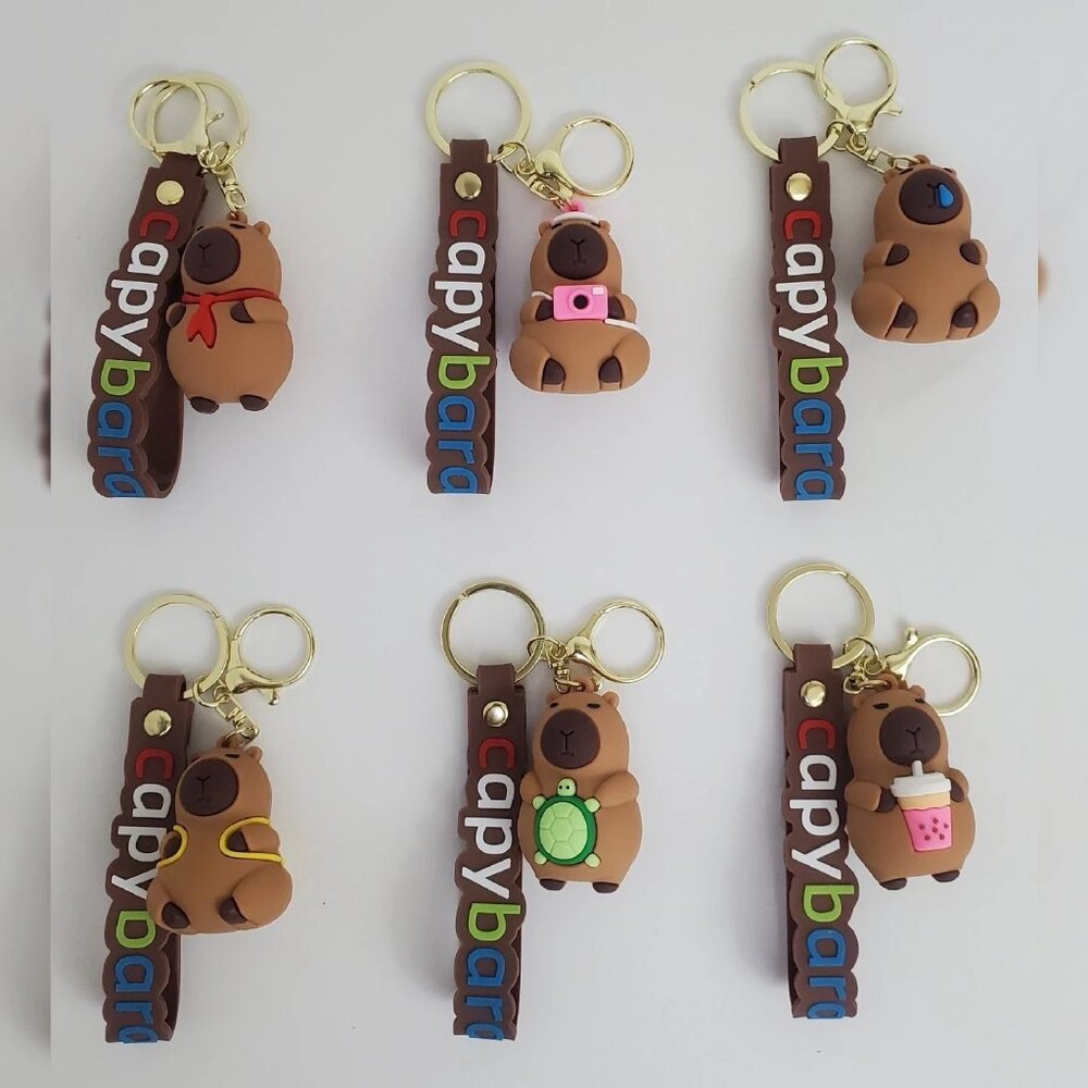 NWT CAPYBARA KEY CHAIN DIFFERENT ACTIONS 3D LOGO